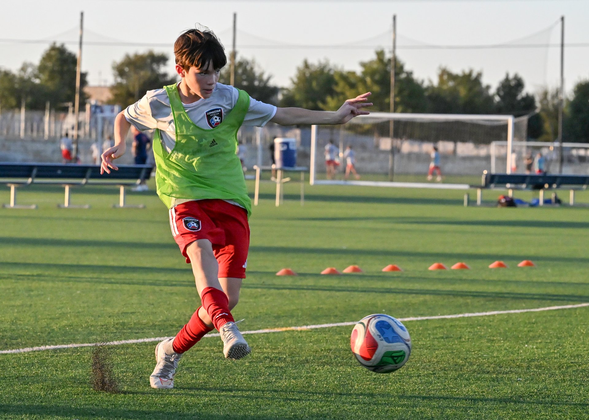 Soccer Player Kicking Ball